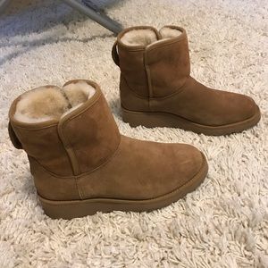 Ugg wedge booties .